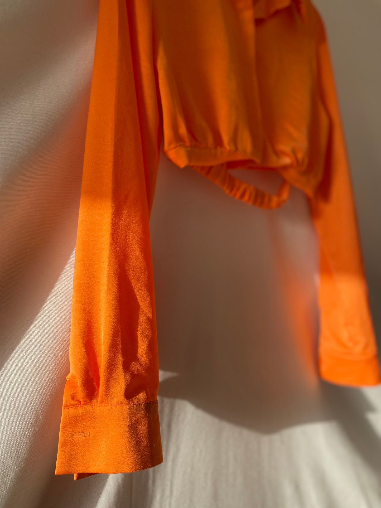 Orange satin blouse